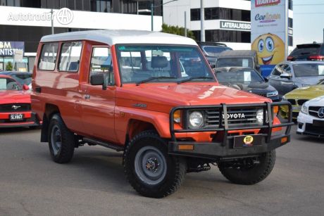 Orange 1995 Toyota Landcruiser Troop Carrier (4X4) 11 Seat